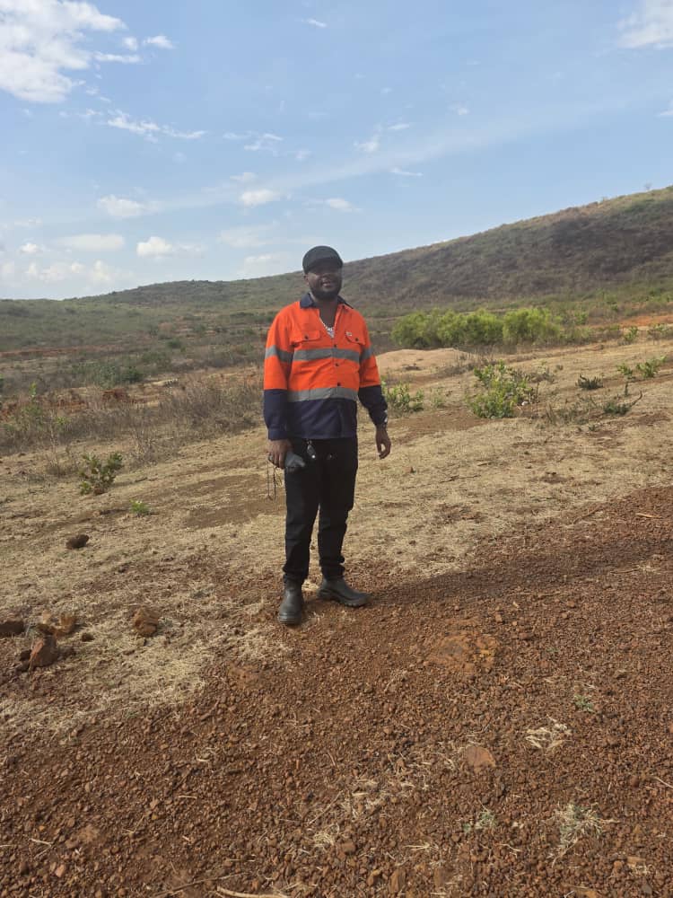 JUKRIS Mining site engineer conducting fieldwork in Tanzania